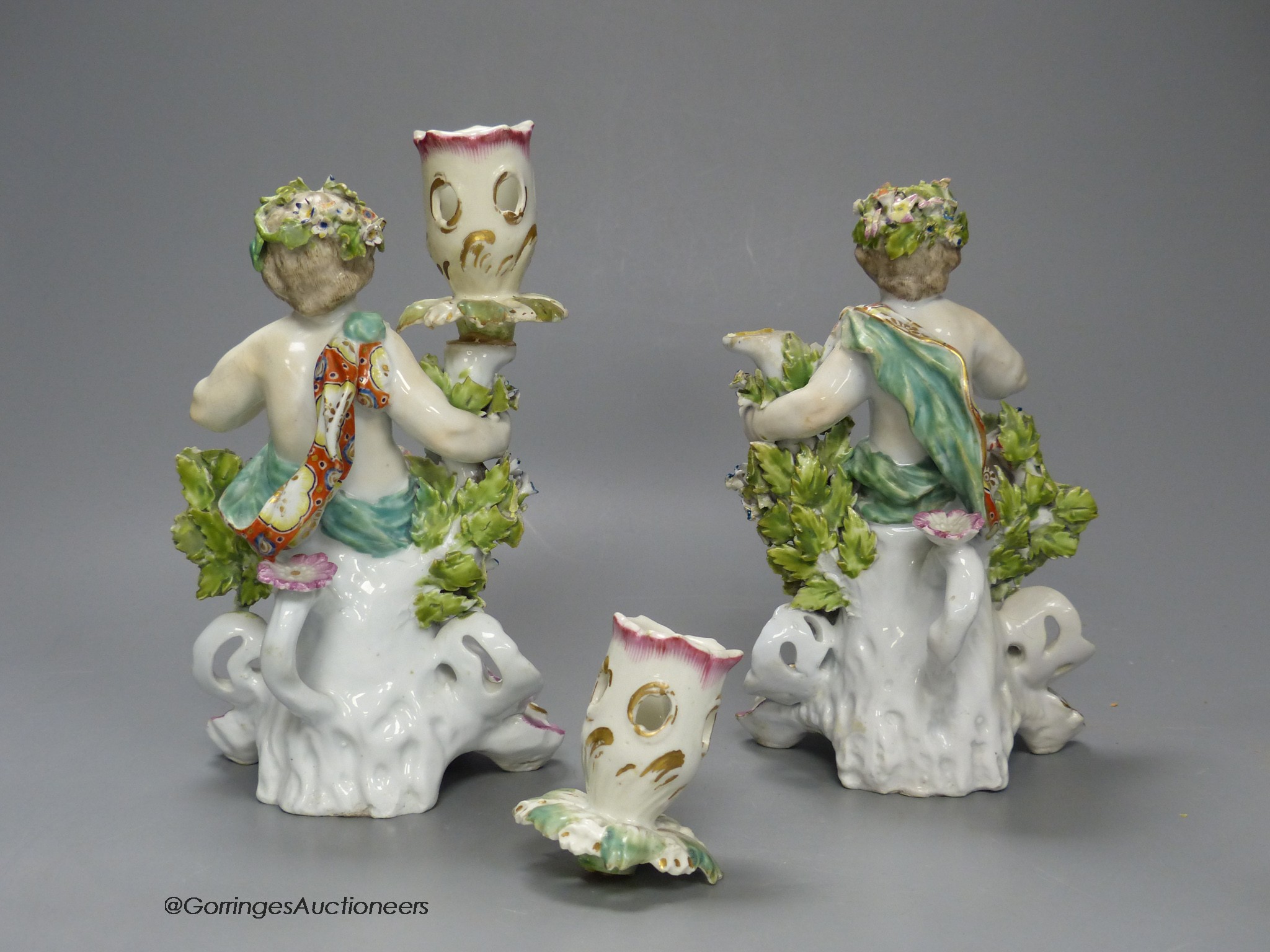 A Derby good pair of candlestick figures of children, 18cm high